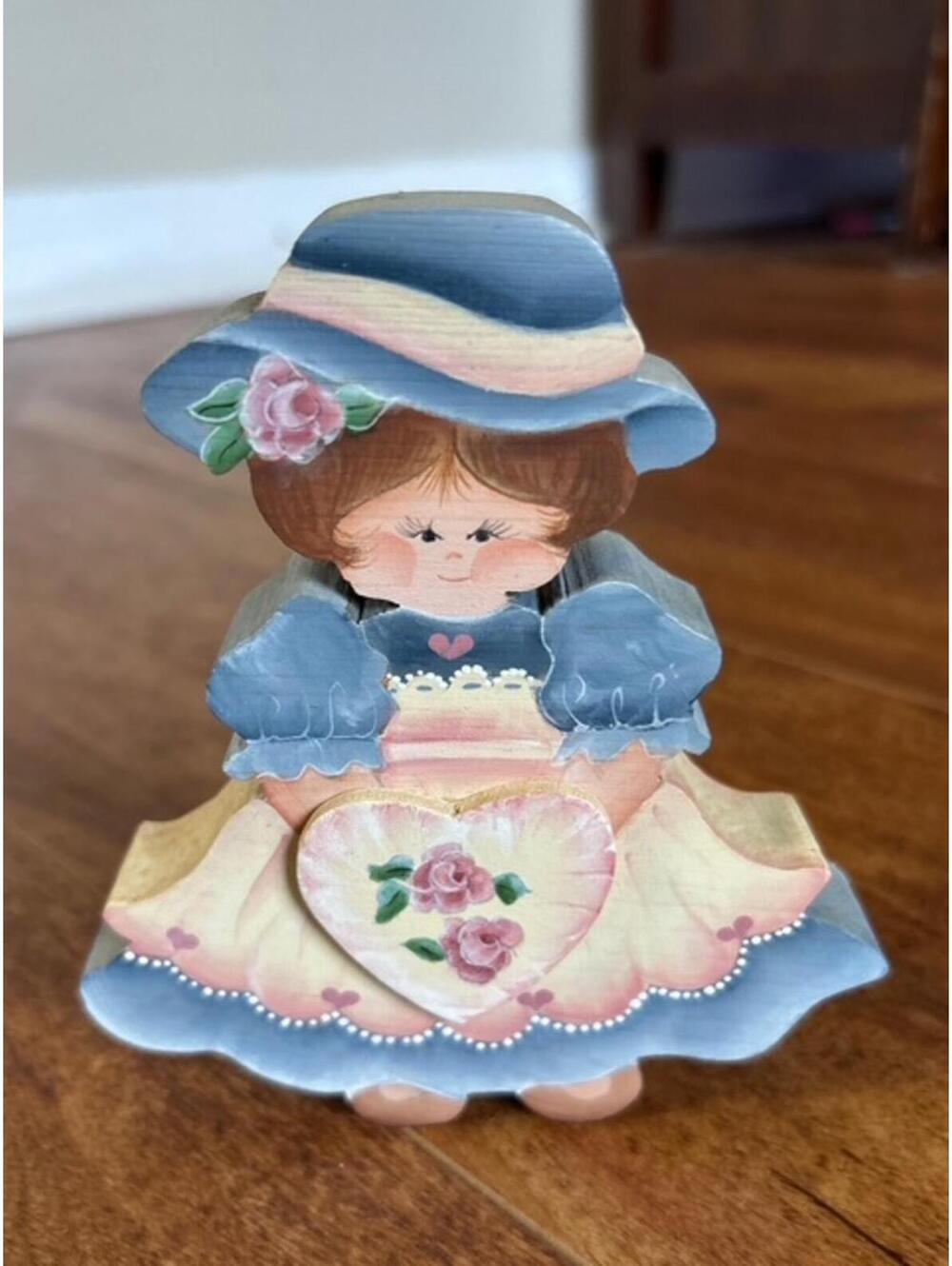 Hand-Painted Wooden Girl Figurine with Floral Heart